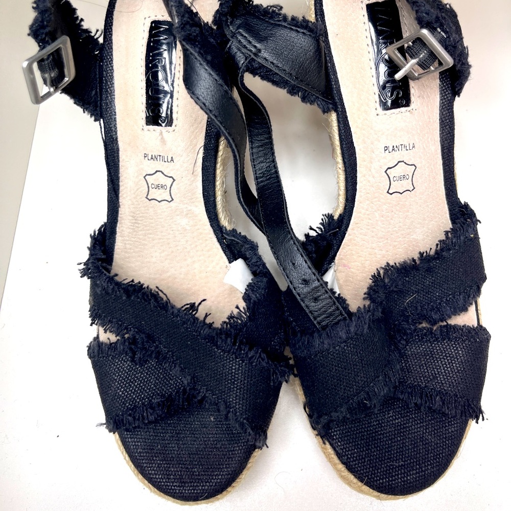 Black canvas espadrilles. Frayed detail with leather insole.